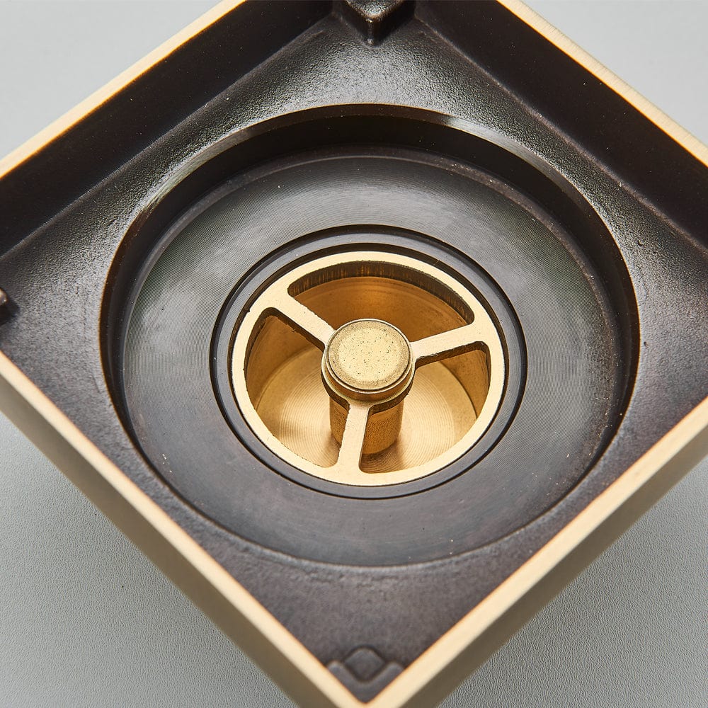 Sifon de pardoseala antimiros, cu iesire verticala, diametru ramă 100 mm, diametru scurgere 38 mm, doua fețe suport fixare placa gresie, auriu nichelat, cod 1521